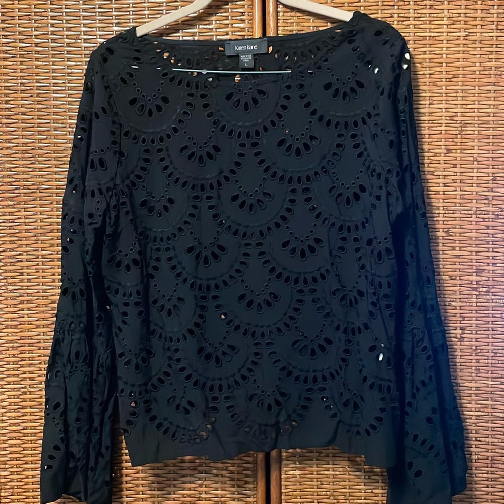 Beautiful Karen Kane eyelet top NWOT black size Large. Nice fit, pretty detail